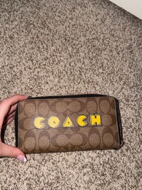 Coach Brown Signature Zip Wallet with Yellow Logo Patch